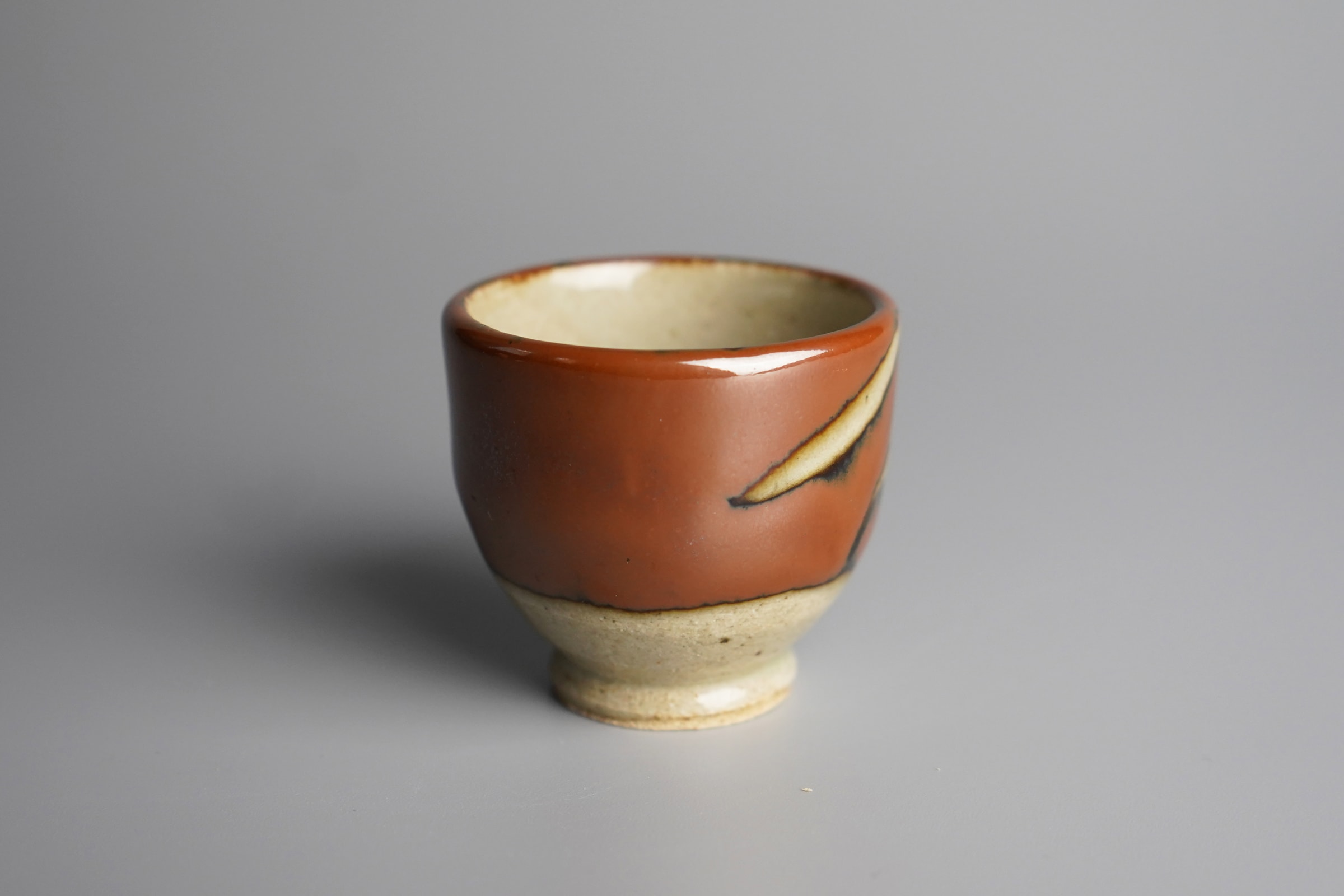 Hamada Shoji 濱田庄司, Persimmon Glazed Guinomi 柿釉抜絵ぐい吞み | Dai Ichi Arts |  Japanese Modern Art