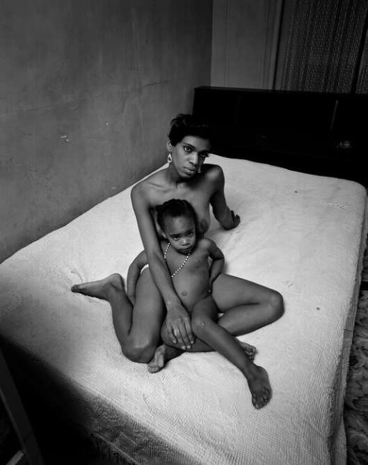 Untitled, East 100th Street (Nude Woman and Child on Bed)
