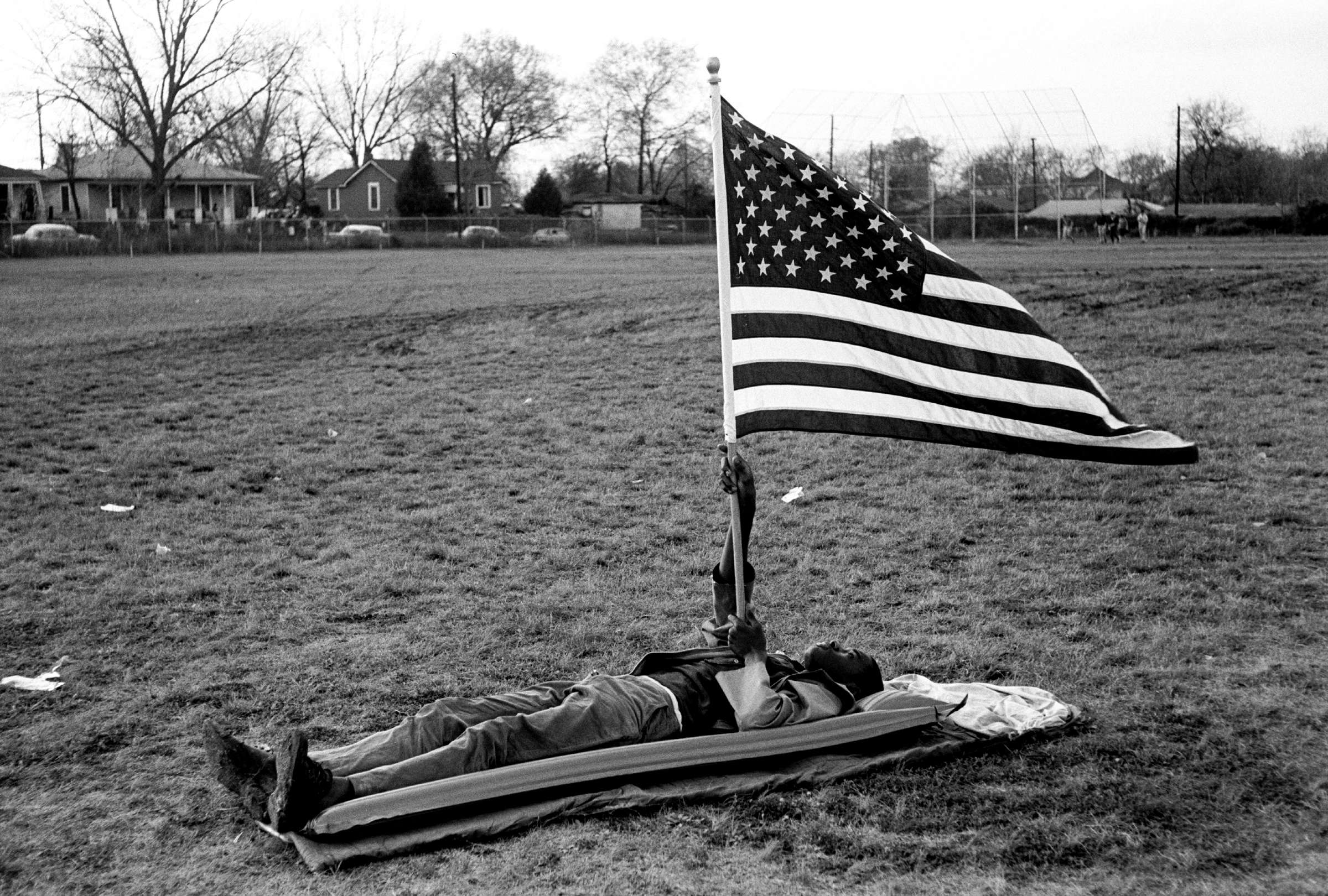 Boy With the Flag on Ground