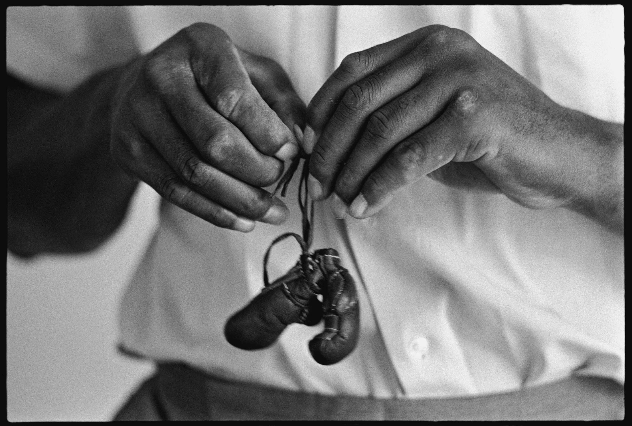Muhammad Ali (Cassius Clay) with mini gloves, Louisville, KY