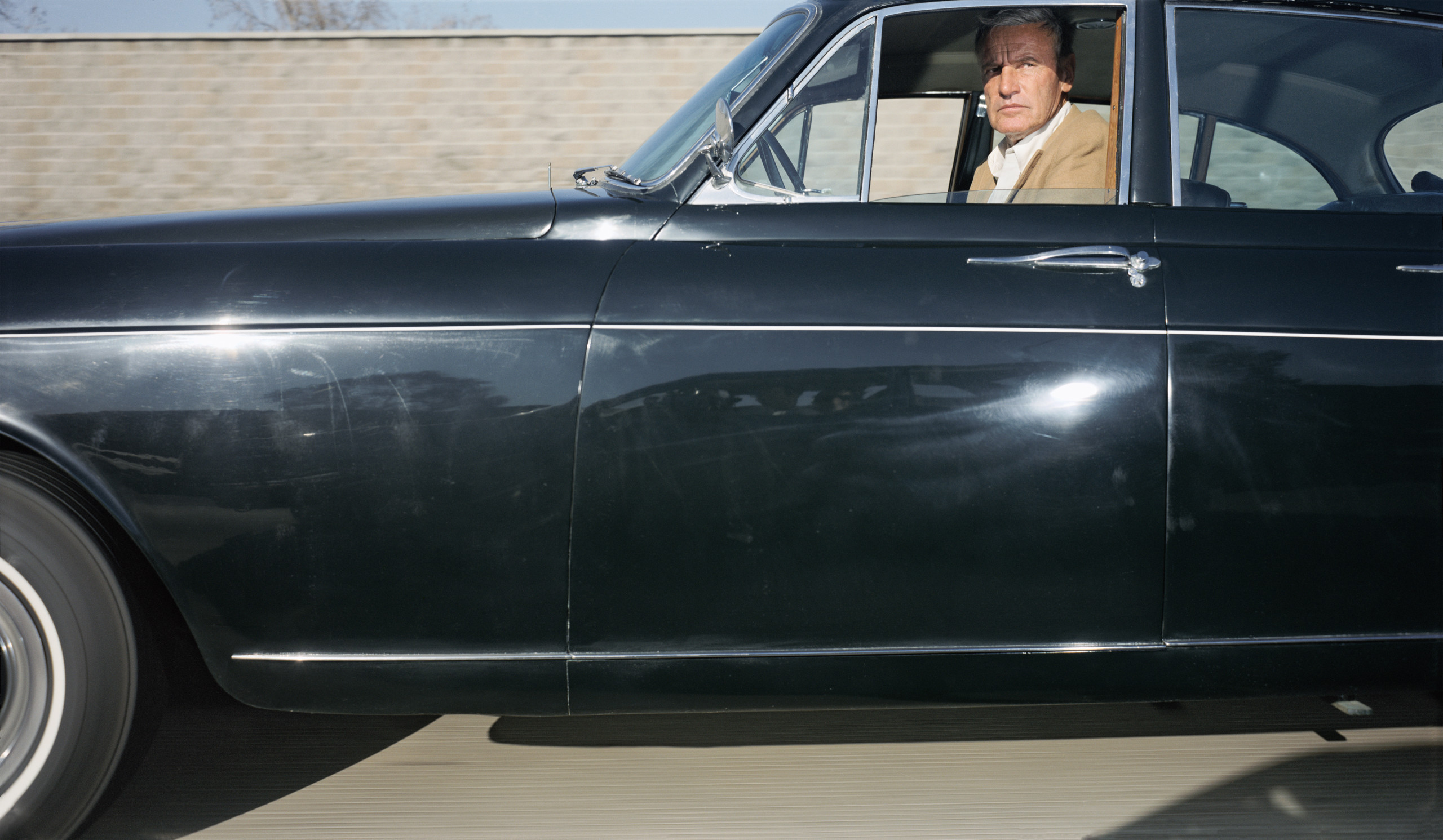 Man (possibly someone in character) traveling northwest at 60 mph on U.S. Route 101 in the vicinity of Hollywood on a late Sunday afternoon in March 1991