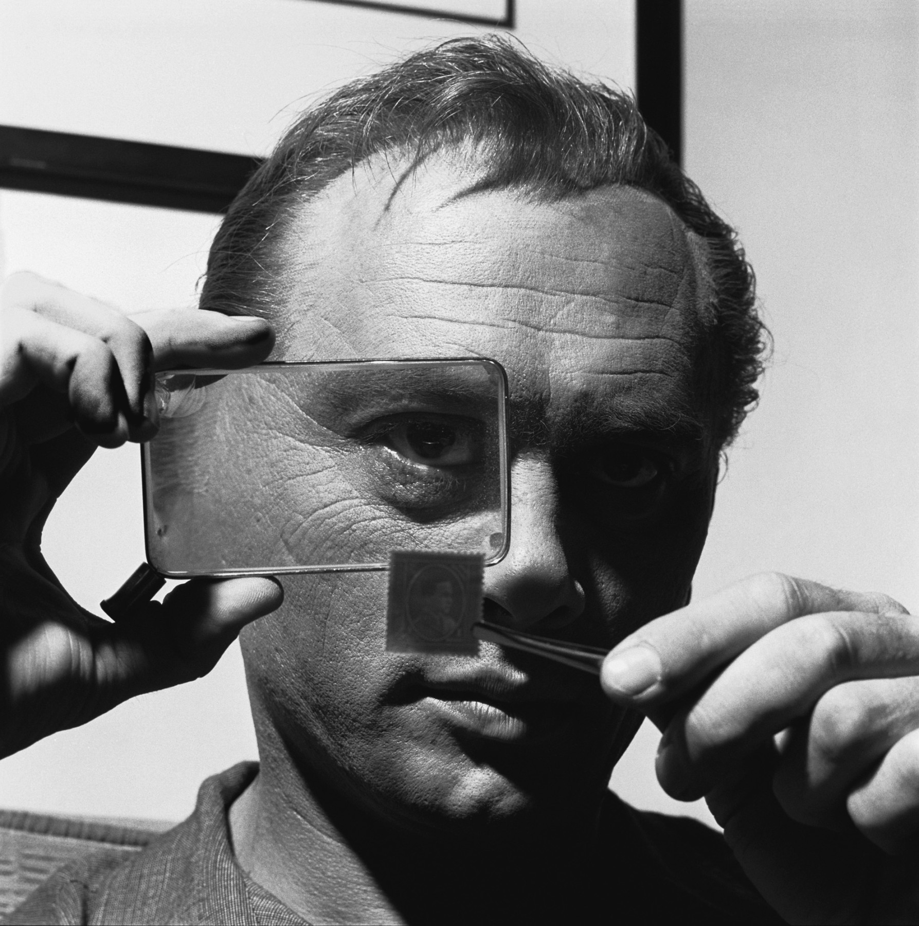 Yul Brynner with His Stamp Collection