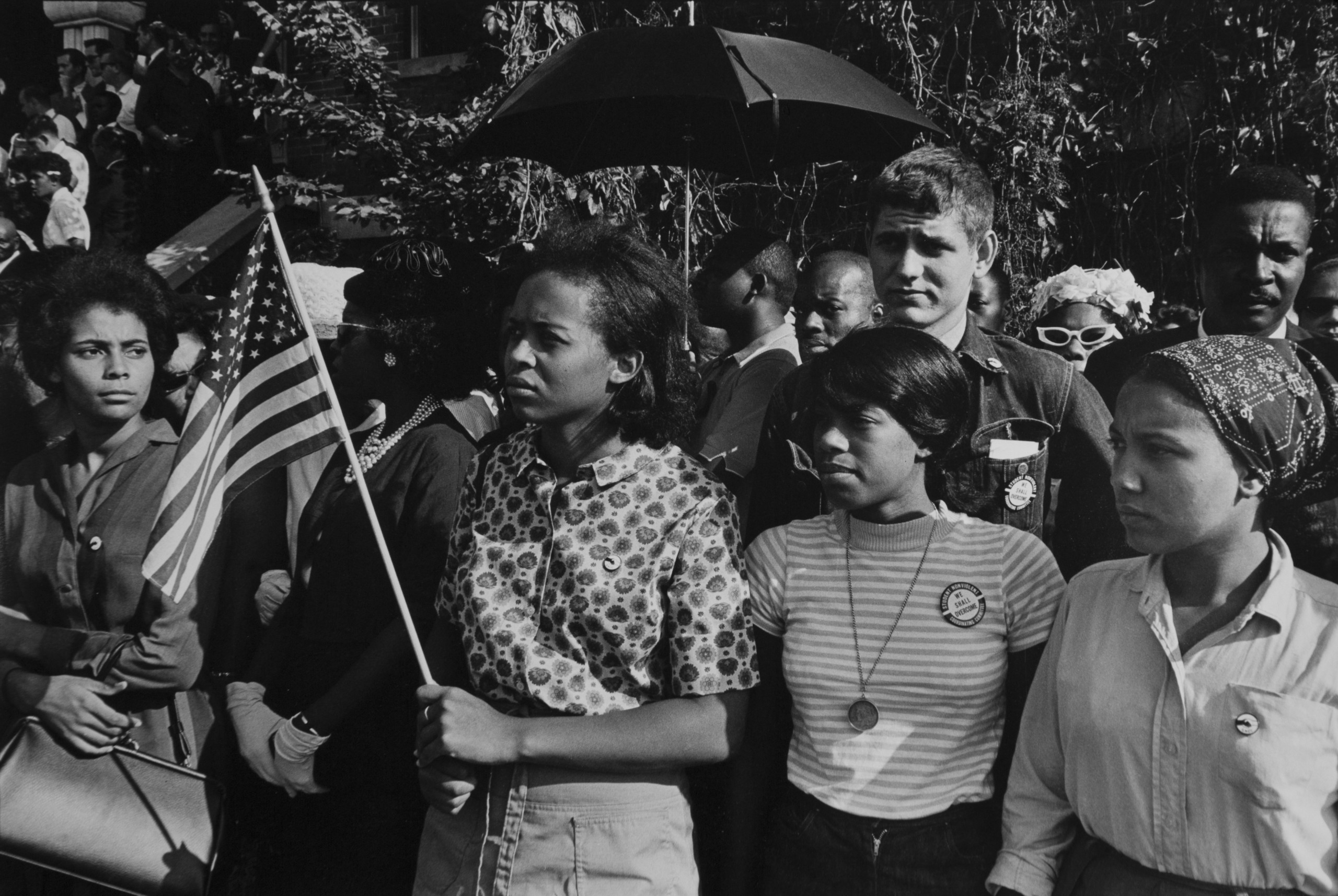 SNCC workers stand outside the funeral: Emma Bell, Dorie Ladner, Dona Richards, Sam Shirah, and Doris Derby