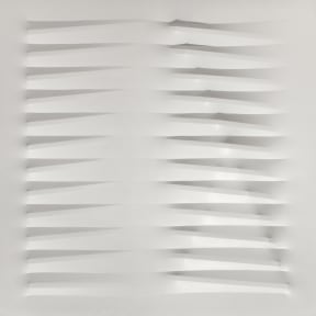 A white wall sculpture made with vinyl tempera laid over nails to create an undulating pattern.