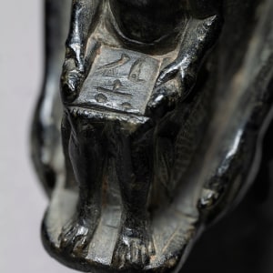 Egyptian theophorous figure, holding a seated statuette of Imhotep, Late Period, 27th-30th Dynasty, c.525-343 BC