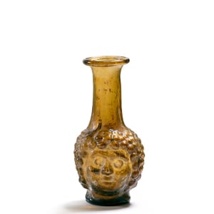 89. Roman janus-headed flask, c.2nd century AD