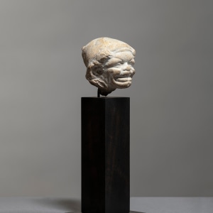 Greek grotesque head of a grimacing woman, c.3rd century BC