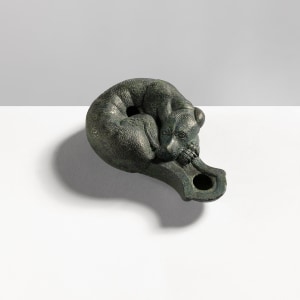 Roman oil lamp in the form of a sleeping hound, Imperial Period, c.1st century AD