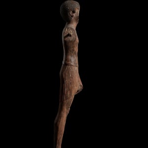 Egyptian statue of a striding male figure, Middle Kingdom, 12th Dynasty, c.1985-1795 BC