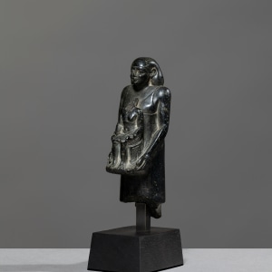 Egyptian theophorous figure, holding a seated statuette of Imhotep, Late Period, 27th-30th Dynasty, c.525-343 BC