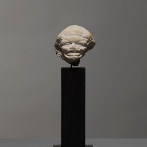 Greek grotesque head of a grimacing woman, c.3rd century BC