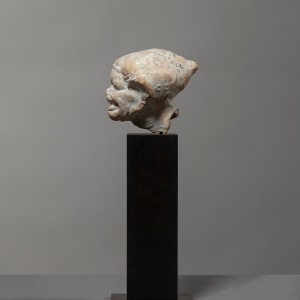 Greek grotesque head of a grimacing woman, c.3rd century BC