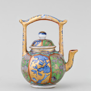 A CHINESE MINIATURE ‘CLOBBERED’ TEAPOT AND COVER, Kangxi 1662-1722