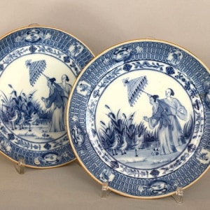 A PAIR OF FINE CHINESE BLUE AND WHITE PRONK ‘DAME AU PARASOL’ DISHES, Qianlong (1736 – 1795), ca. 1736-1740.