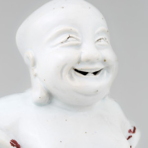 A DEHUA FIGURE OF BUDAI, 18th century