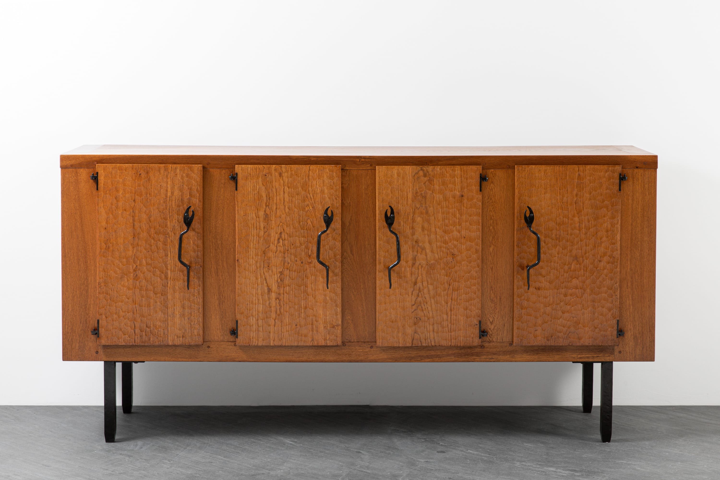 'Serpent' sideboard, c. 1960 - Oak wood, iron details Jean Touret & the Artisans de Marolles