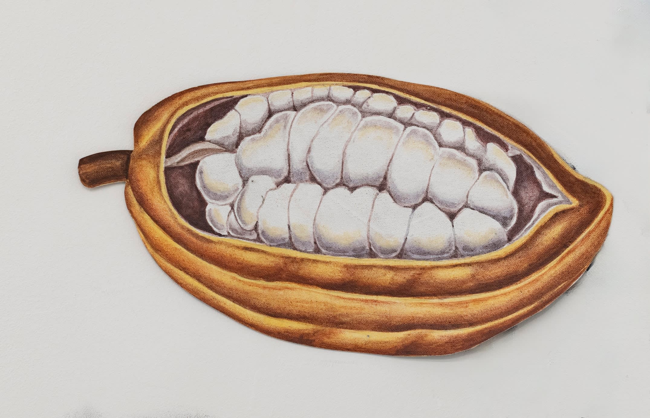 On the ground floor, a wall painting of tropical rainforests, painted in dark gray chalk, unfurls along the wall like...