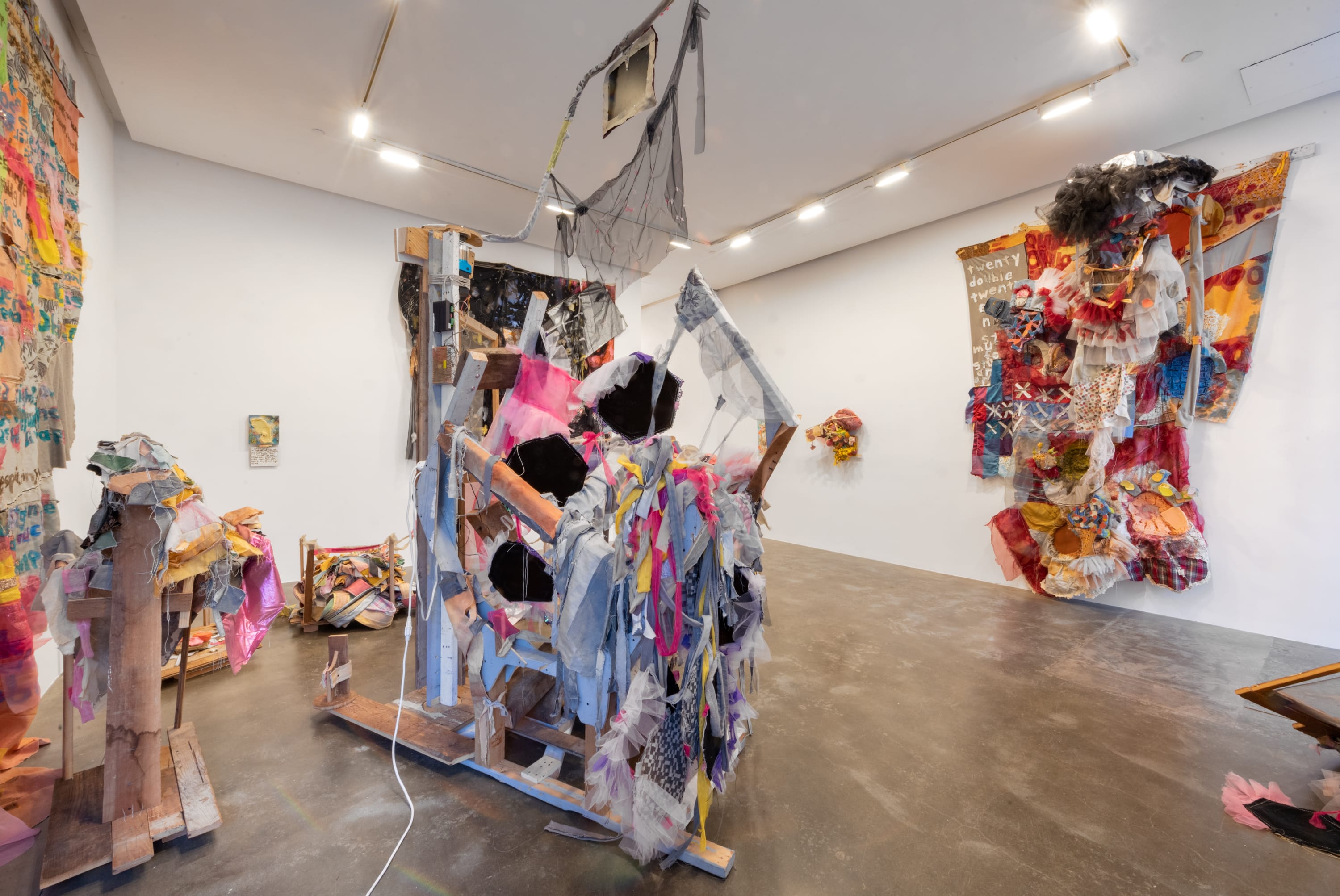 Main gallery installation view of Greg Smith's exhibition Absent Word Double at Susan Inglett Gallery showing various fabric and wood based artworks