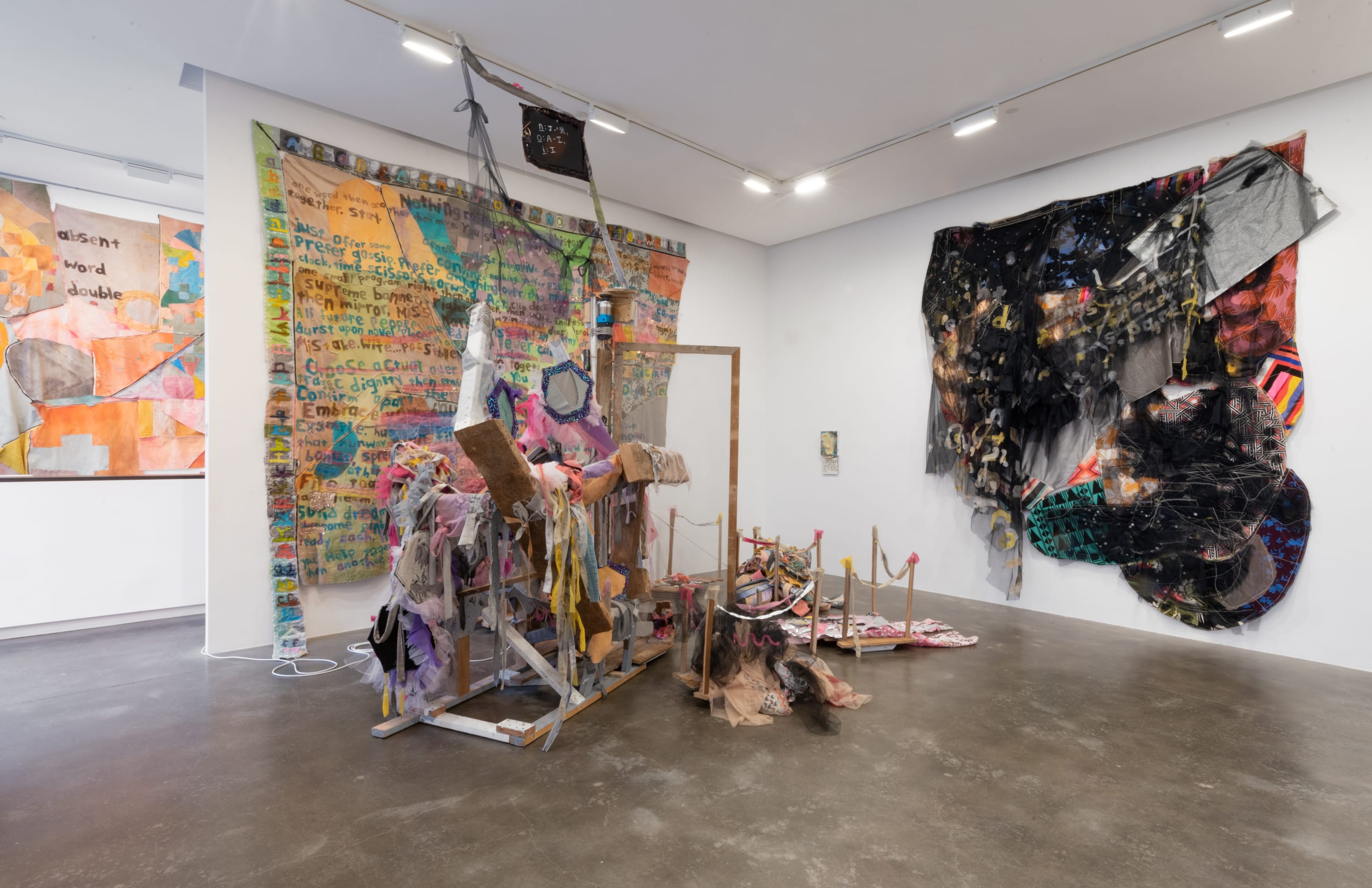 Main gallery installation view of Greg Smith's exhibition Absent Word Double at Susan Inglett Gallery showing various fabric and wood based artworks