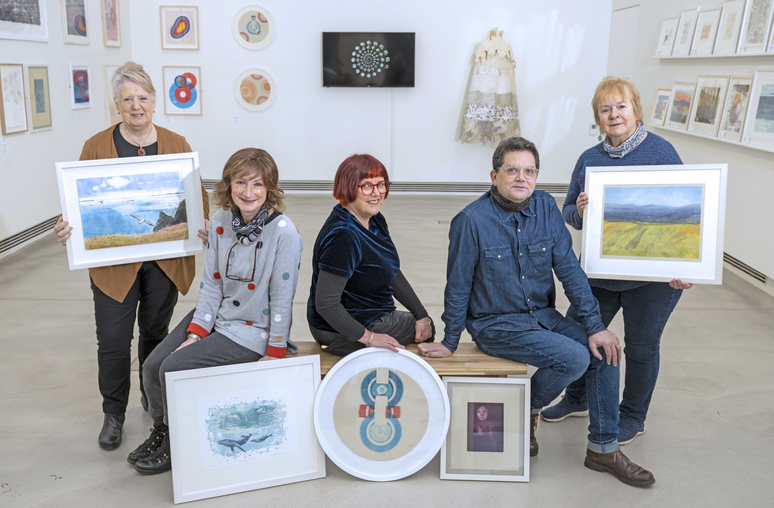 From left to right: Artists Doreen Boogert, Nicky Sanderson, Fiona Maher, Brian Speedie and Rona MacLean with their work in...