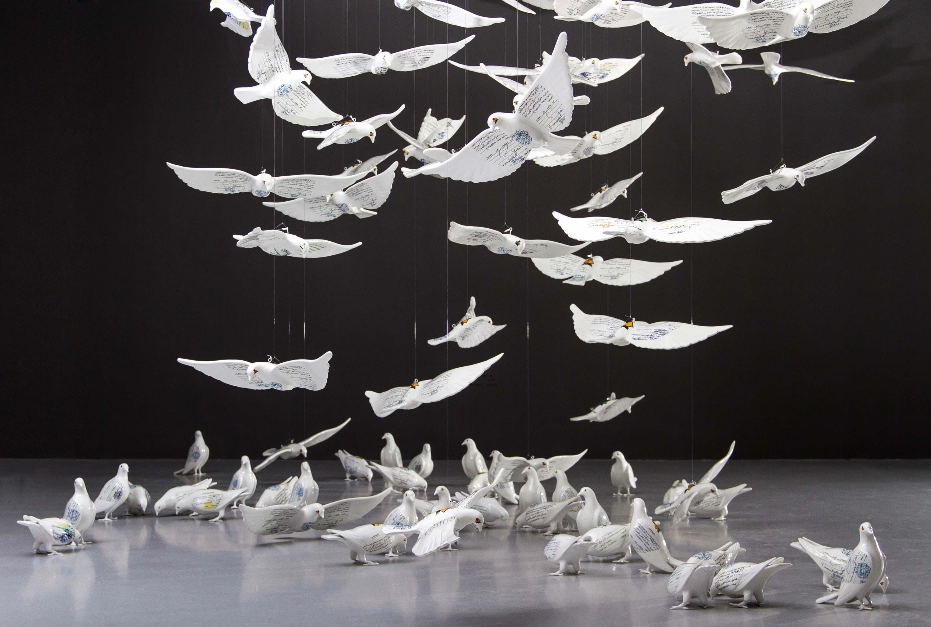 “Suspended Together” is an installation that gives the impression of movement and freedom. However, a closer look at the 200...