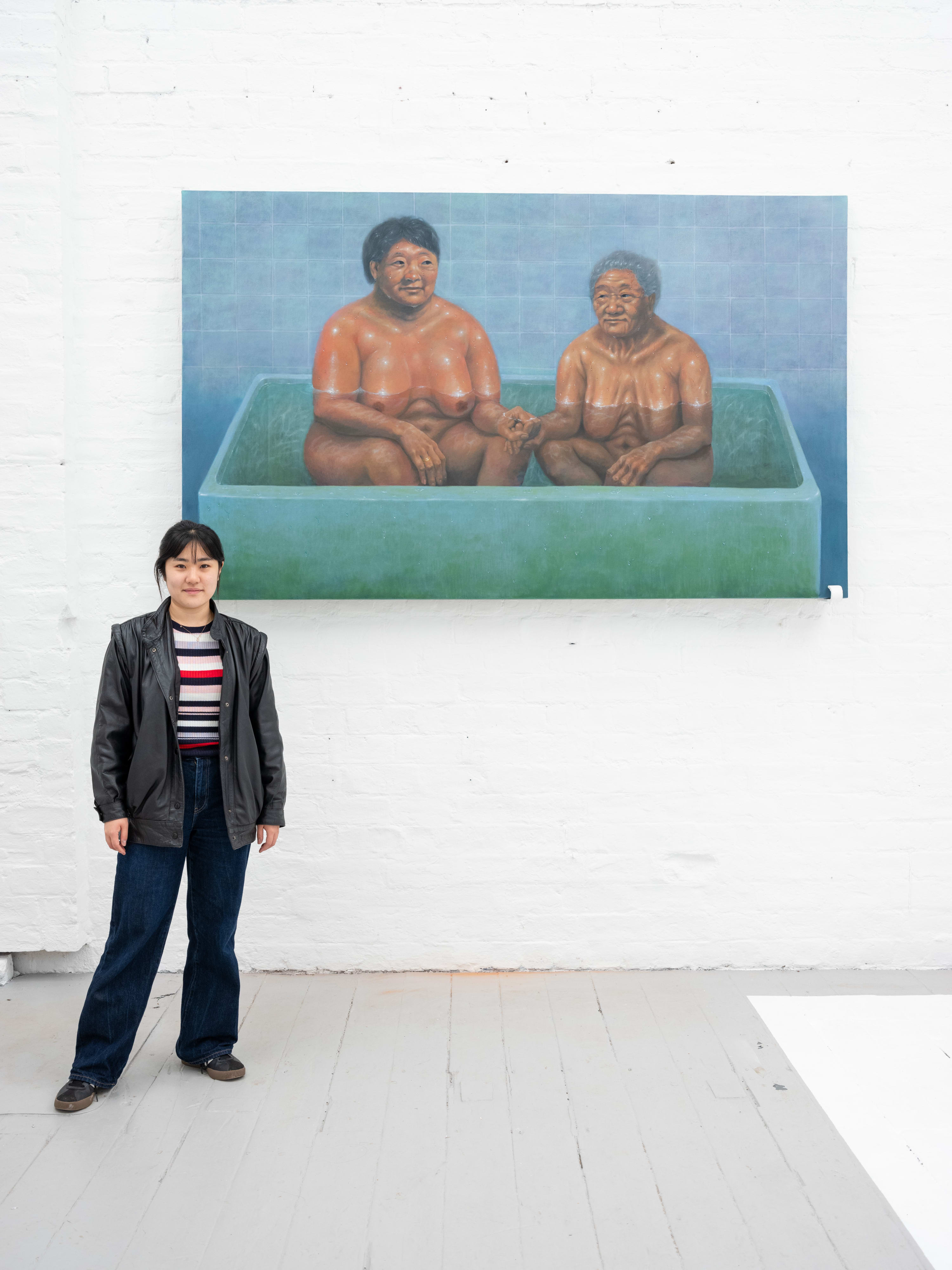 Heeyoung Noh with her painting A mother and her daughter