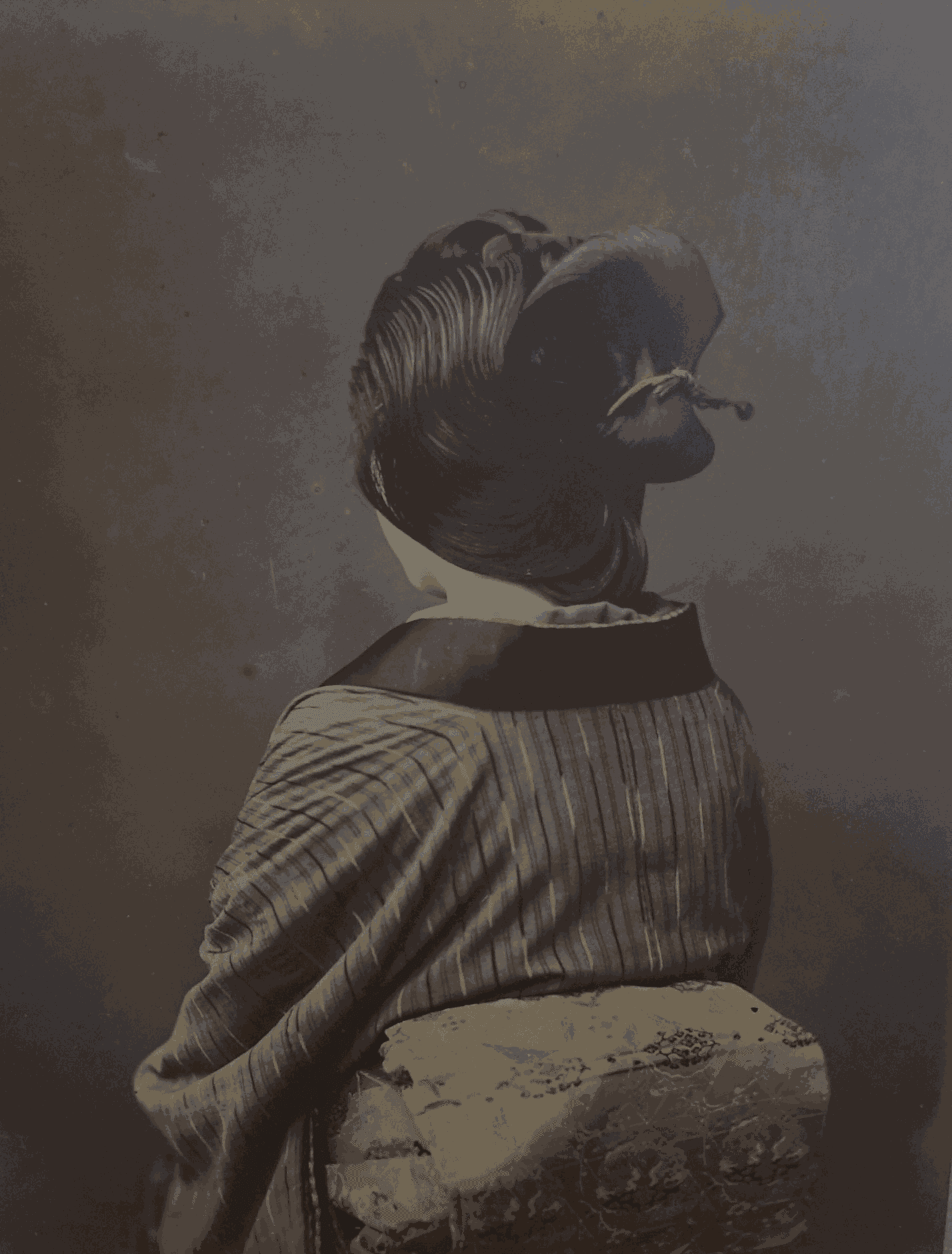 UNKNOWN PHOTOGRAPHER, Japanese woman showing back of hair and obi (sash), C. 1885