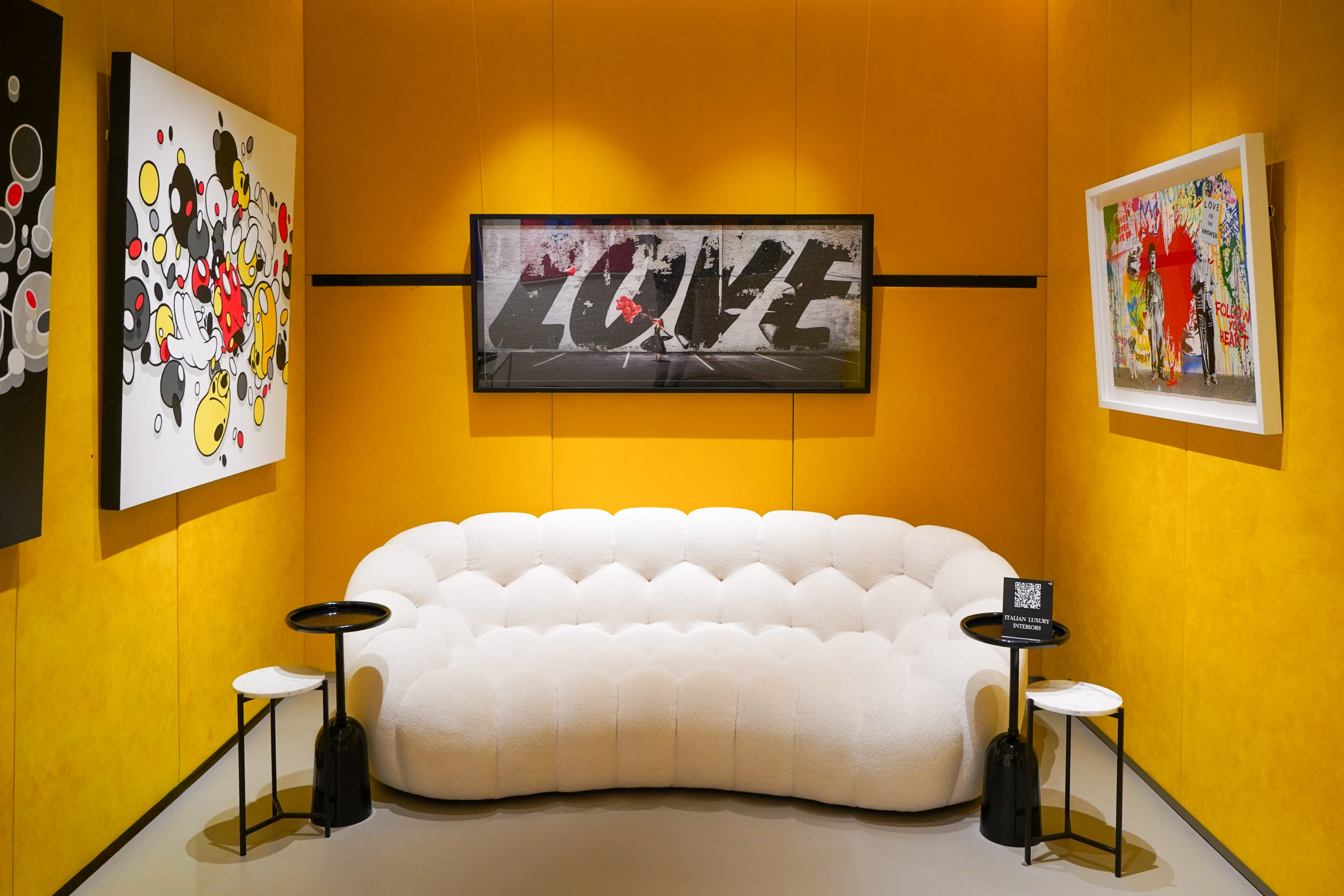 Collector lounge surrounded by incredible works by David Drebin, Opake, Mr. Branwash.