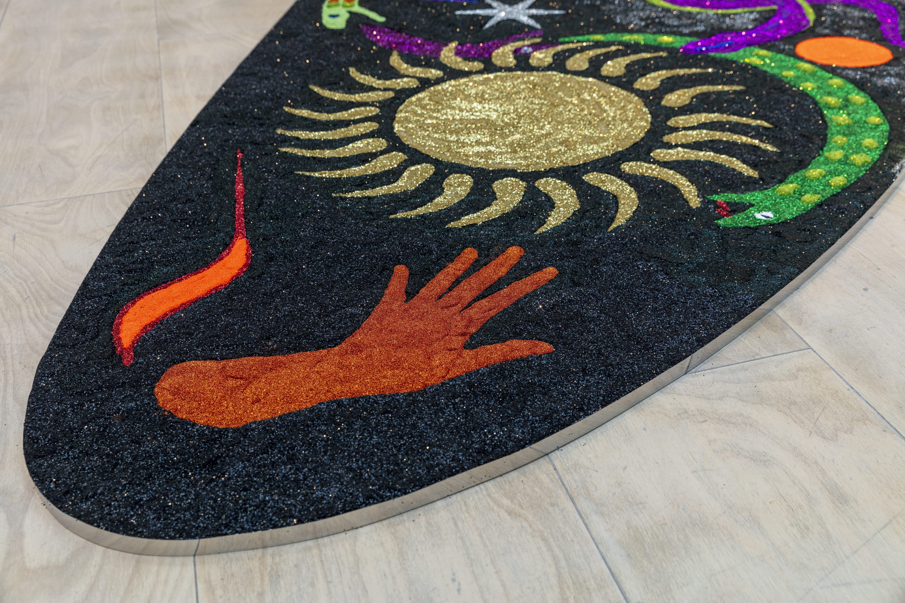 Fátima Rodrigo, Piedra de sol, serpiente de humos, 2024, site-specific installation, glitter, 475 x 208 cm (187 x 81 7/8...