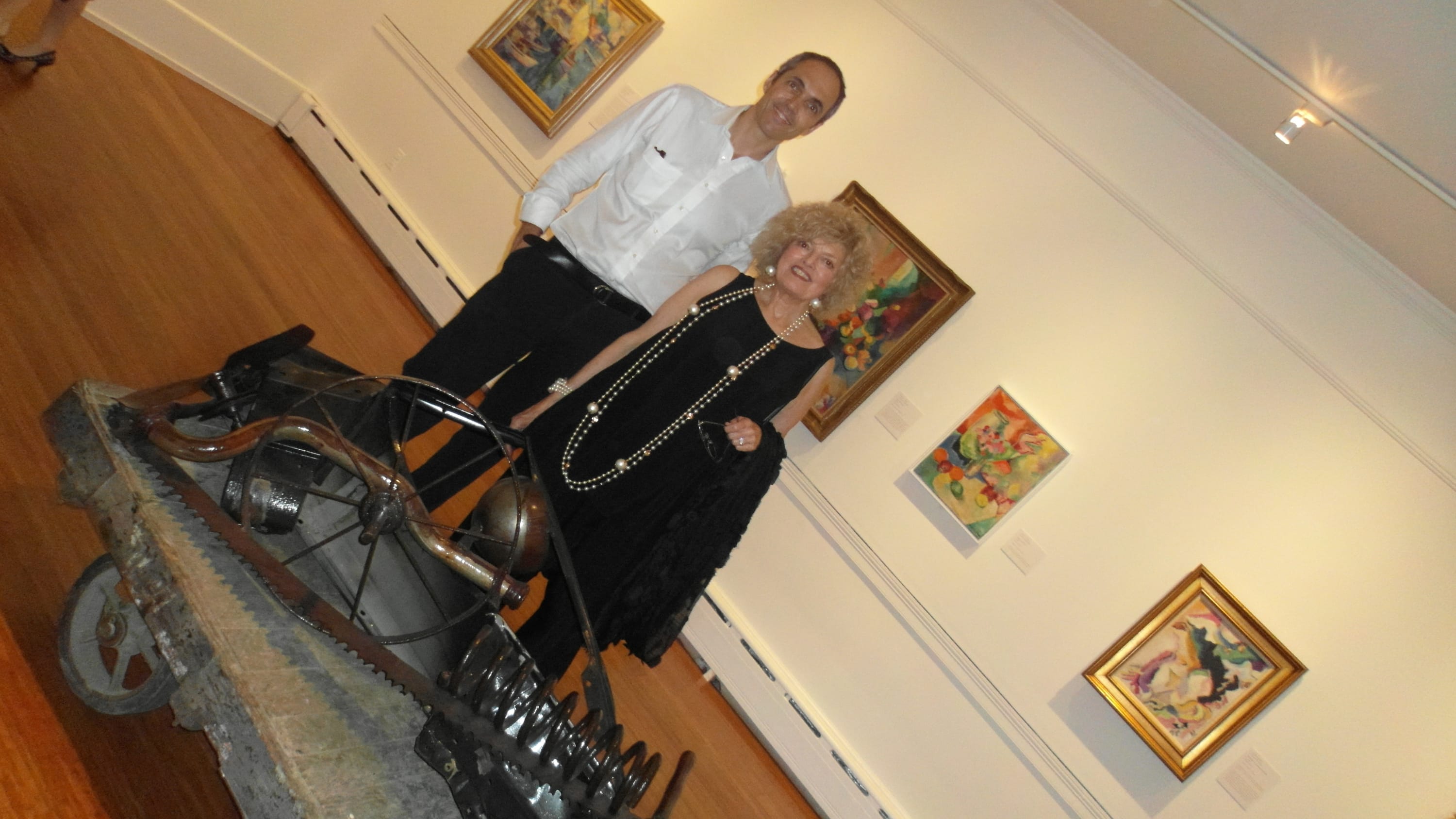 Dina and her son John pose next to her welded assemblage 'Black Earth #1' at the exhibition New Acquisitions at...