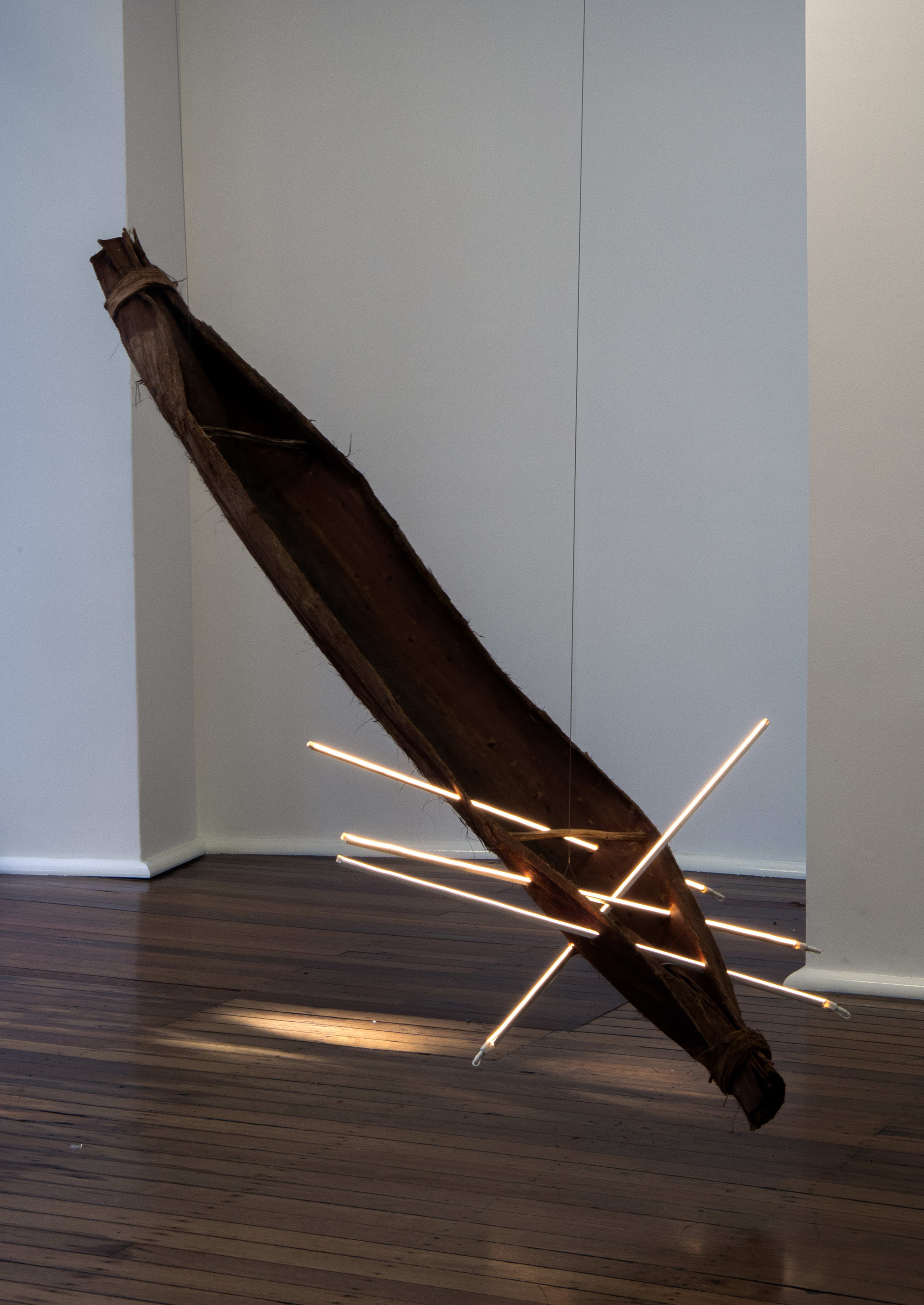 Aidan Hartshorn Madhawu Yiri (Heavy Light), 2025 muriin (bark canoe) and LED rods 27 x 350 x 45 cm