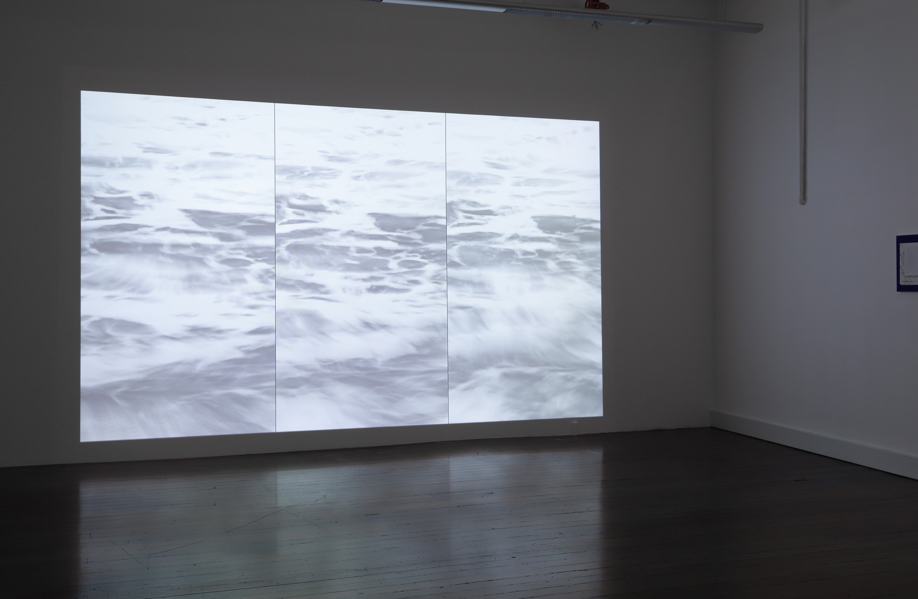 Tom Blake⁠ leaves on the sea, 2024⁠ three-channel video 01:18, continuous loop