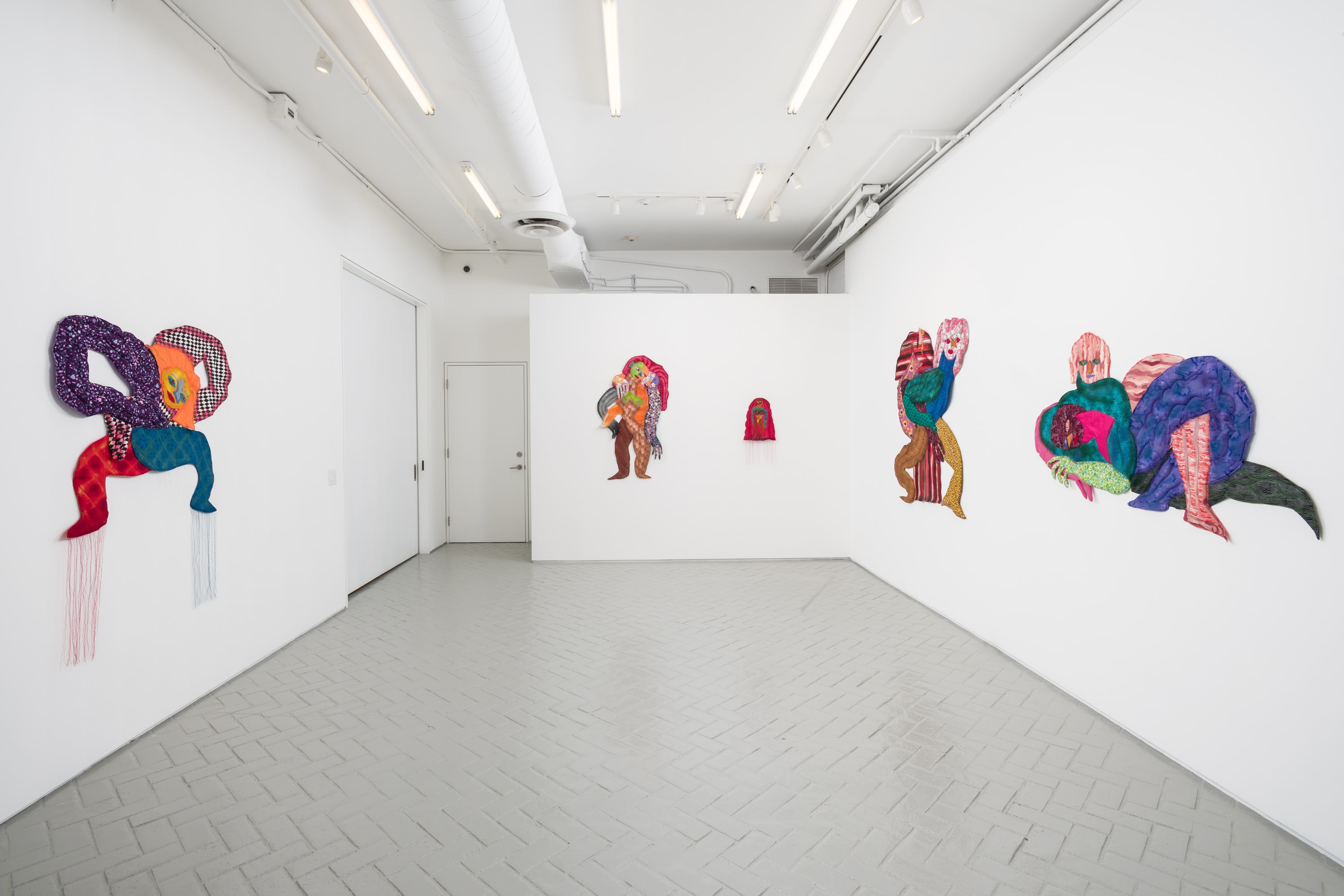 Installation of large artworks in exhibition Maria Guzmán Capron