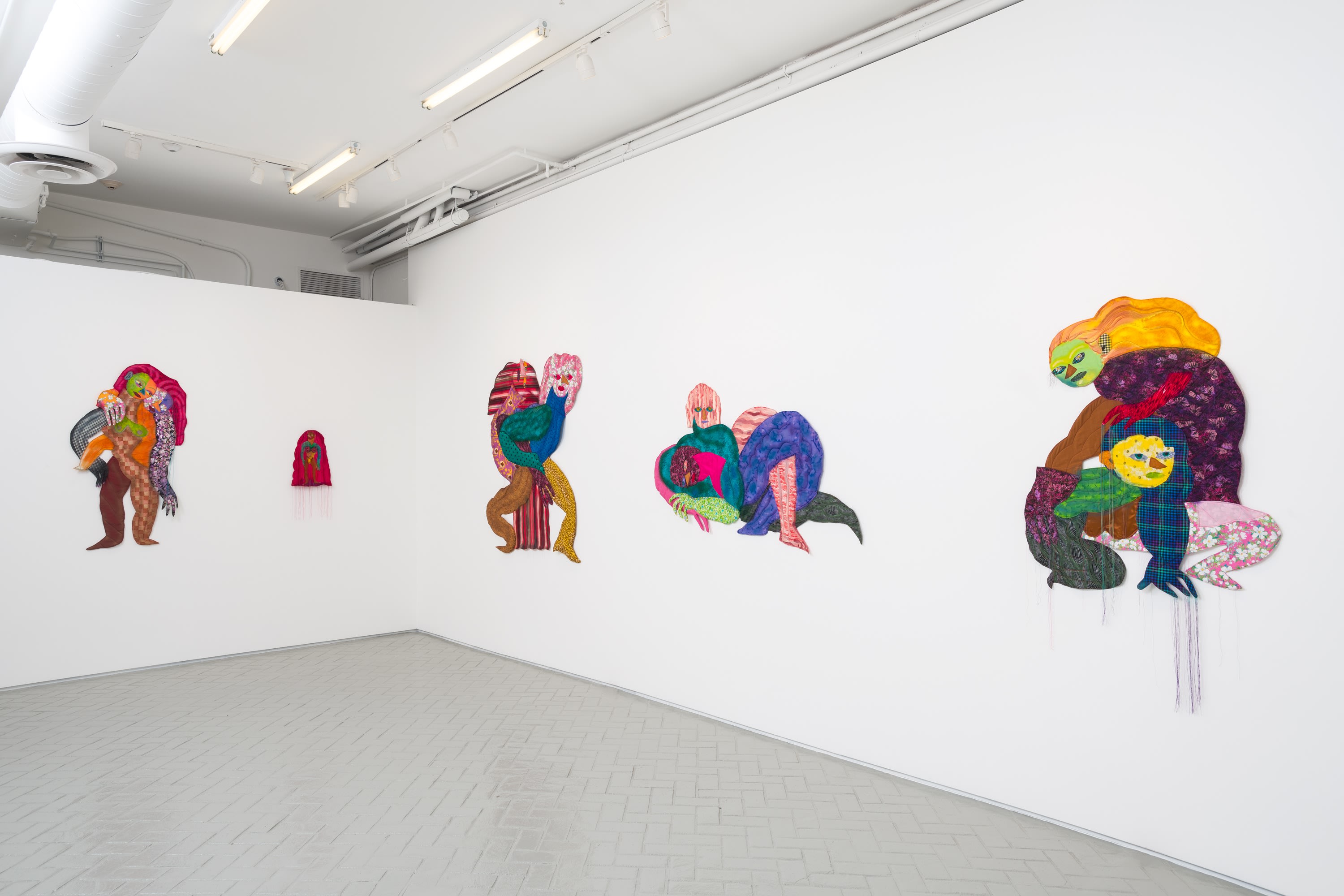 Installation of large artworks in exhibition Maria Guzmán Capron