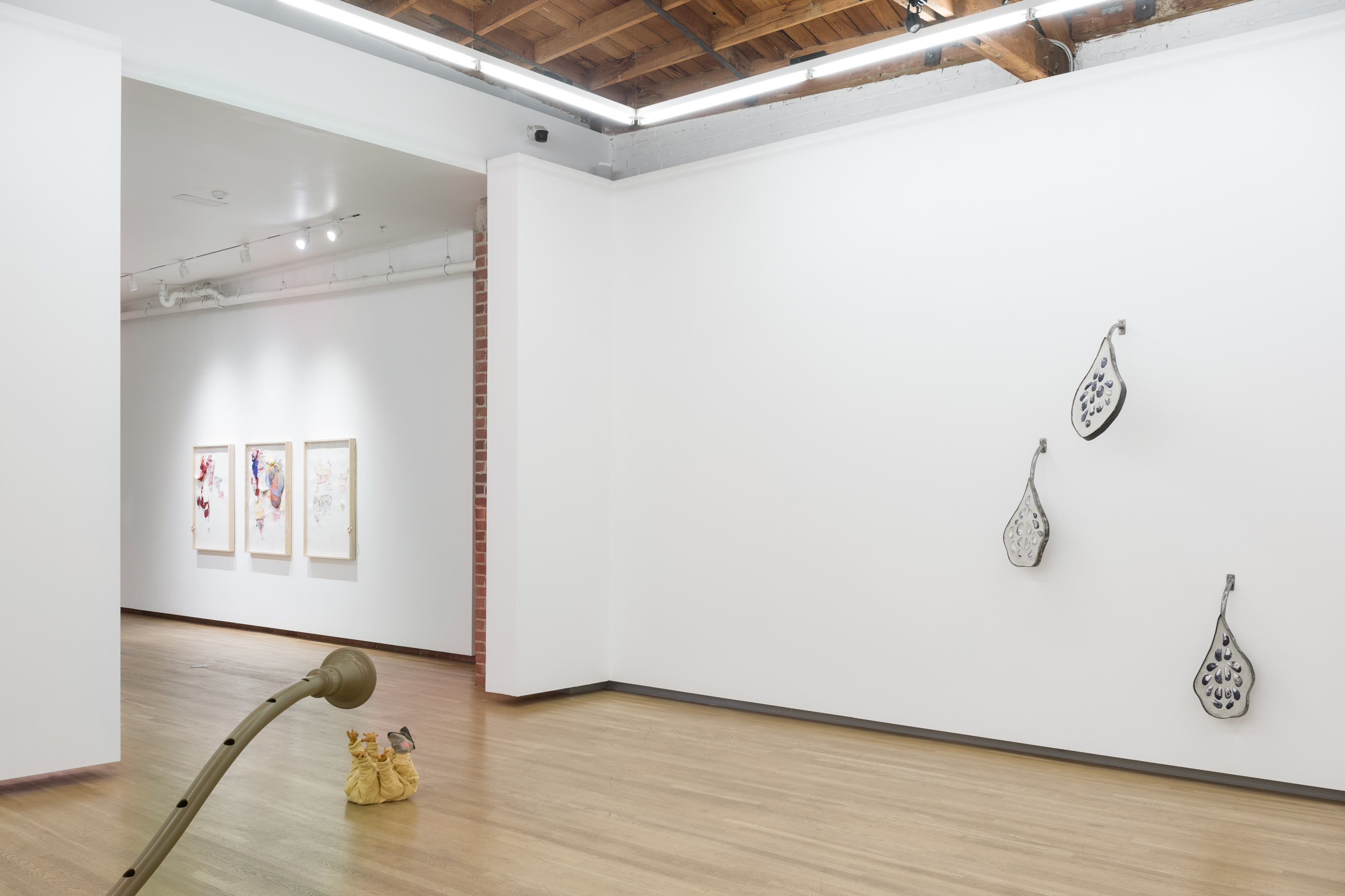 Installation of large artworks by Tori Wrånes in exhibition