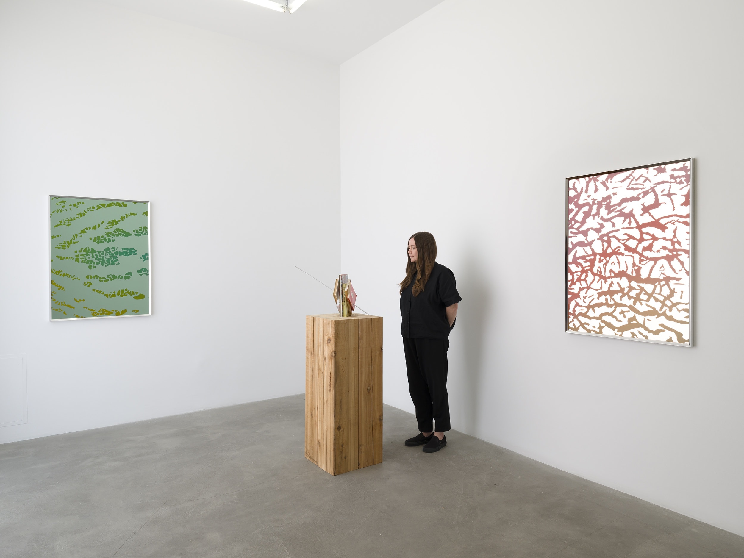 Installation image with two mirror works and one sculpture