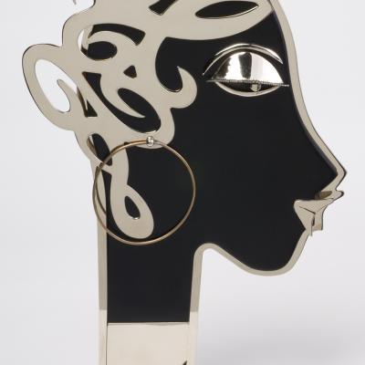 Franz Hagenauer  The Profile, Circa 1930s  Stamped: HAGENAUER with WHW monogram  Wood, Chrome, and Brass  13 1/2 H x 9 W x 4 D inches each  Pair of two figures, one facing left, the other facing right