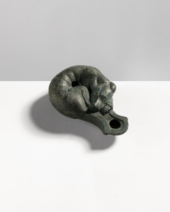 Roman oil lamp in the form of a sleeping hound, Imperial Period, c.1st century AD
