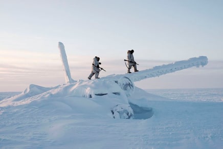 Louie Palu, On reconnaissance outside Resolute Bay on Cornwallis Island, Nunavut, Canadian Arctic Operations Advisors walk on the wreckage of an airplane in temperatures below minus 50 degrees Celsius, 2018