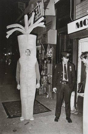 Jill Freedman, Untitled [Man in carrot costume with cop], 1978
