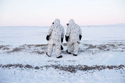 Louie Palu, Canadian Arctic Operations Advisors walk on the shore of a lake on Cornwallis Island, Nunavut. This special unit of soldiers was created to advise and support soldiers who are less experienced in the Arctic and also is mandatory for any soldiers who wish , 2017