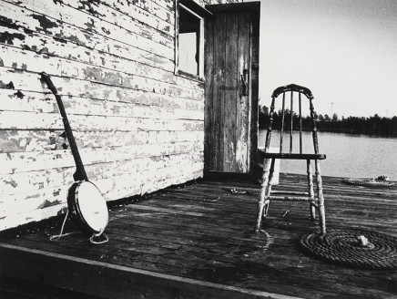 Larry Towell, Untitled [Banjo and chair on porch], circa 1974