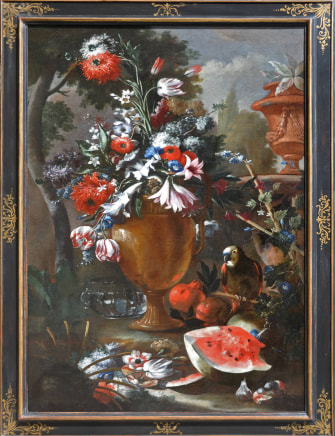 Aniello Ascione (Naples, fl. 1680-1708), A still life of flowers in an urn with a parrot, melon, pomegranates and figs at its base, a view to an ornamental garden beyond