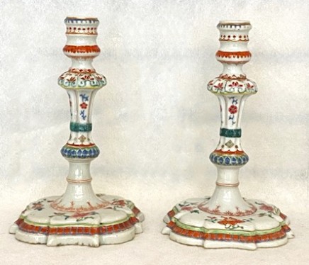 A PAIR OF CHINESE FAMILLE ROSE CANDLESTICKS, Qianlong (1736 - 1795)