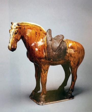 A GLAZED POTTERY FIGURE OF A HORSE, Tang Dynasty