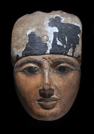 An Egyptian wood sarcophagus mask