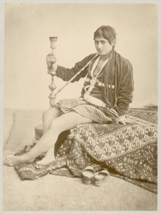 Antoin Sevruguin, A Persian women with a water pipe, Late 19th Century or early 20th Century