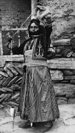 Not known, A Nestorian woman weaving wool on a hand spindel, Late 19th Century