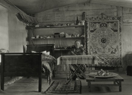 Joseph F. Rock 1884-1962 Joseph Rock at home, photographic plates drying above his bed, Nguluko, China, circa 1928 Press caption, with annotations and stamps, in ink, au mount verso Printed circa 1928 Gelatin silver print mounted to 6 3/4 x 9 inch (17.15 x 22.86 cm) period board 5 1/2 x 7 3/4 in 13.97 x 19.69 cm