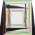 A trapezoidal canvas with black edges and telescoping, multicolored squares with dangling wavy lines